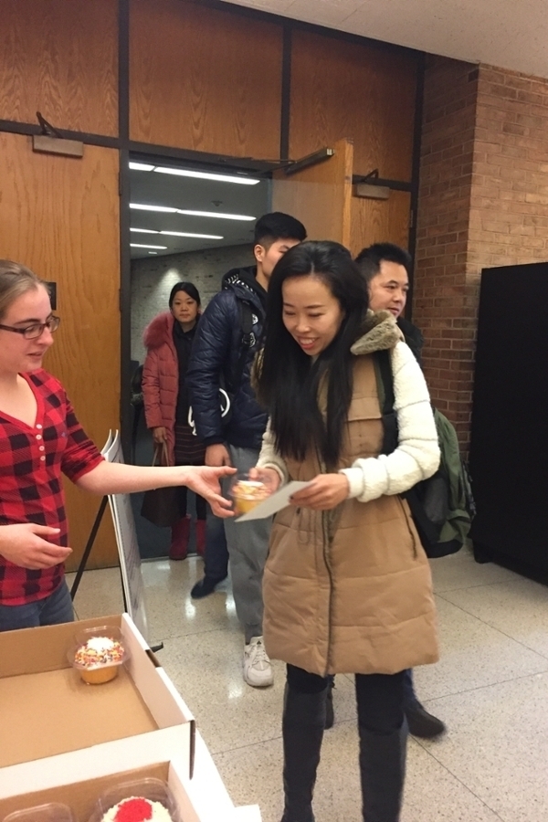 Harry Lum Day Spring 2018 student receiving cupcake