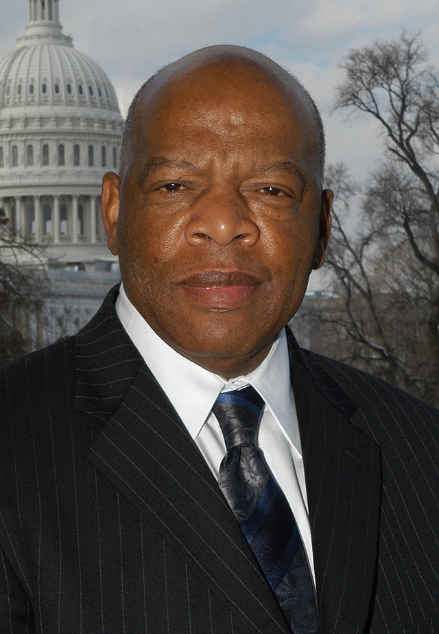 Photo of John Lewis, Congressman and Civil Rights Activist, standing in front of the US Capitol