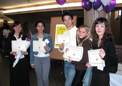 group of 5 students holding up certifications in the year 2005