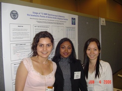 group of 3 female students in front of presentation poster in 2006