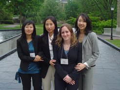 four female students wearing formal attire posing outside in 2007