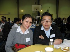male and female students sitting at table