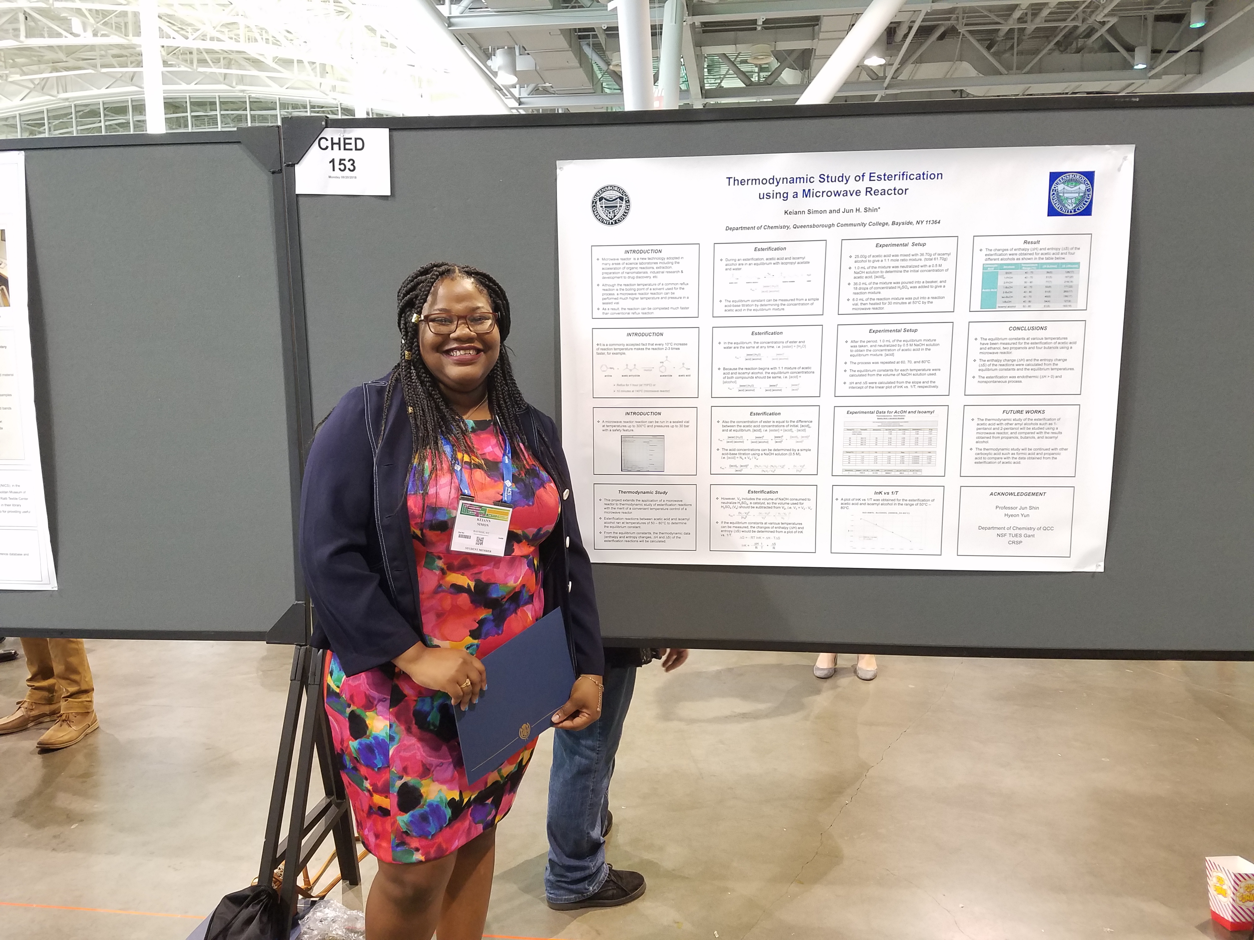 female student standing in front of poster presentation 2018