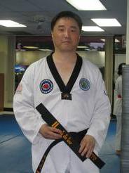 Dr. Shin wearing Taekwondo attire