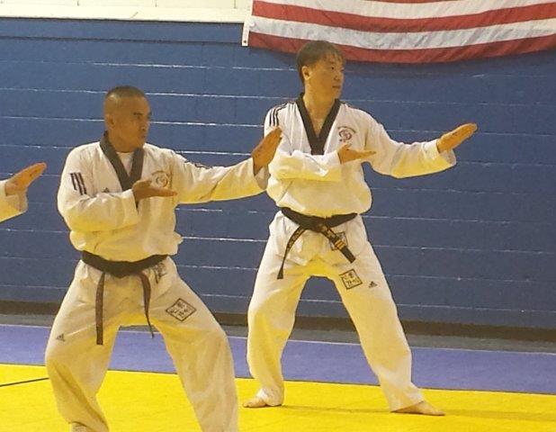 2 males in Taekwondo positions