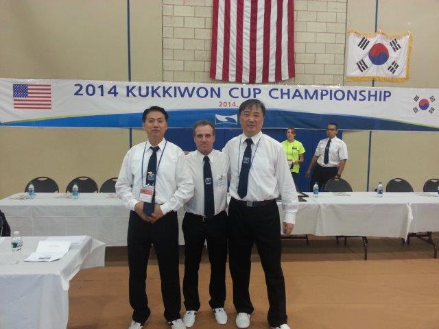 3 males posing at the 2014 Kukkiwon Cup Championship