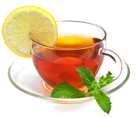 cup of tea with lemon and sprig of mint to reinforce healthy eating leads to healthy living