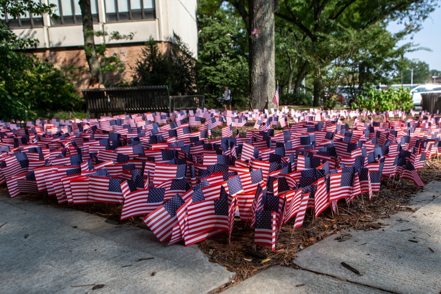 Hundreds of flag fill garden beds in the quad.