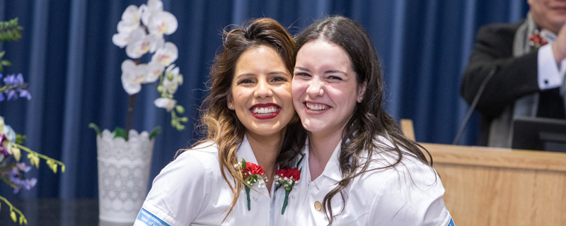 2 female nursing students smiling 