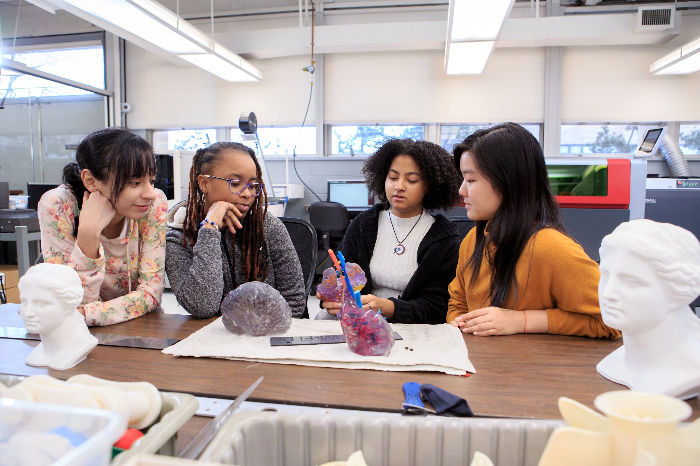 Nyasia Miranda, Circe Gedeon, Dayana Iciano and Rebecca Huynh at the College’s Mechanical Engineering Technology Laboratories