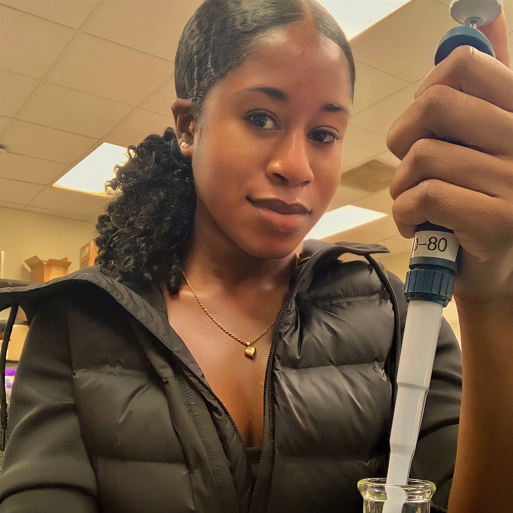 Jernaire Mitchell holding a pipette