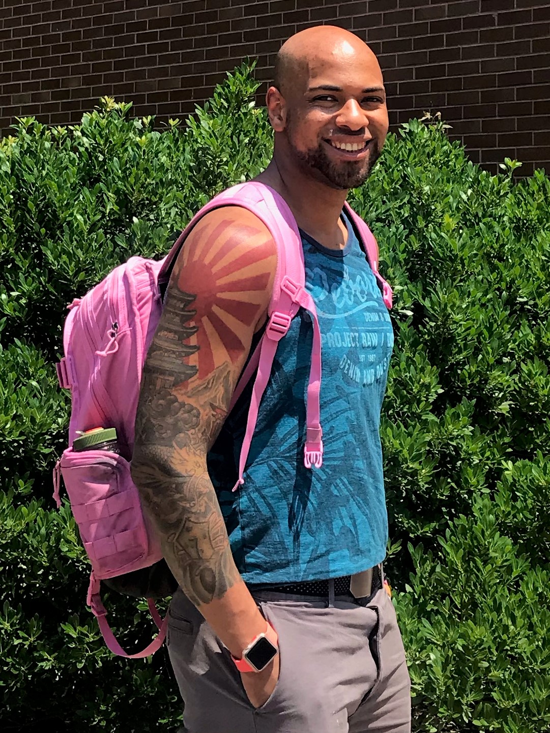 Queensborough undergraduate researcher and summer intern, Adam McConnell, wearing a pink bookbag
