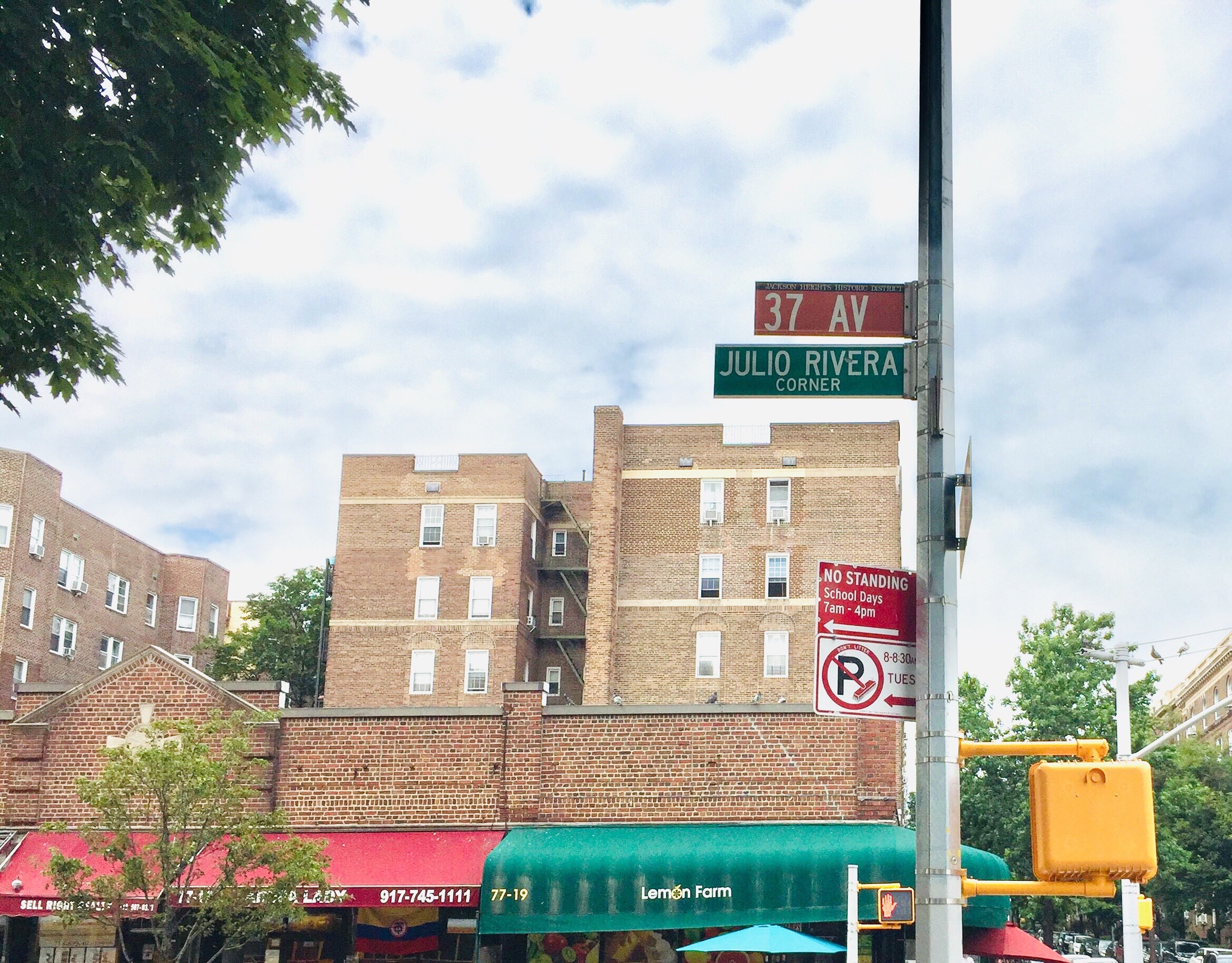 Street sign in Jackson Heights, Queens, NYC, honoring Julio Rivera: Julio Rivera corner